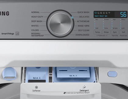 Delicates option selected and detergent drawer open on a Samsung washer