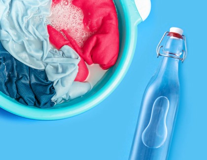 Clothes soaked in Vinegar with Vinegar bottle next to it