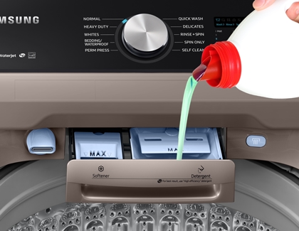 Detergent being poured in the detergent drawer of Samsung Washer