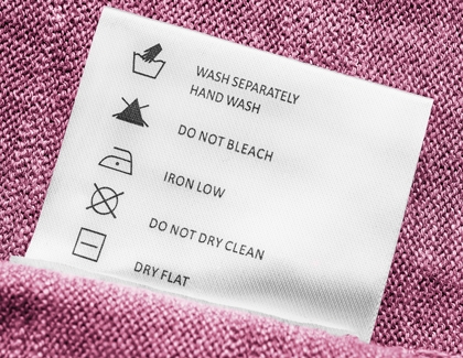 Cloth washing instruction on costume showing hand wash