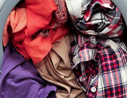 A washer overloaded with clothes