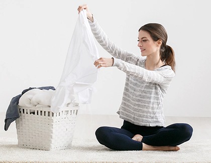 Woman sorting clothes