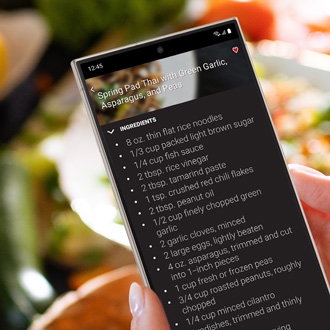 Hand holding Galaxy phone while displaying a recipe in the Chef Collection app