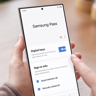 Person holding a Galaxy phone while displaying Samsung Pass
