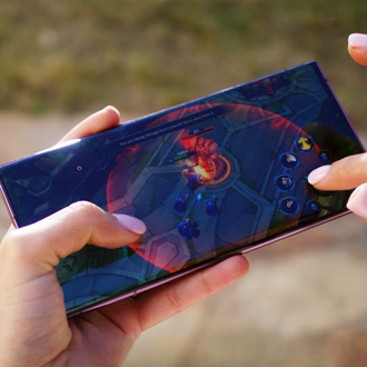 Person playng a game on a Galaxy phone