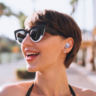 Woman listening to audio on Samsung Galaxy Buds2 Pro