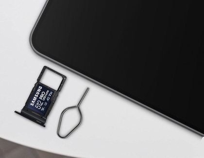 Samsung Galaxy A26 5G with SIM tray, SIM ejector tool, and 512GB microSD card.
