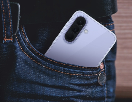 A light purple Galaxy A37 protected by a clear case sitting in the front pocket of a pair of blue jeans.