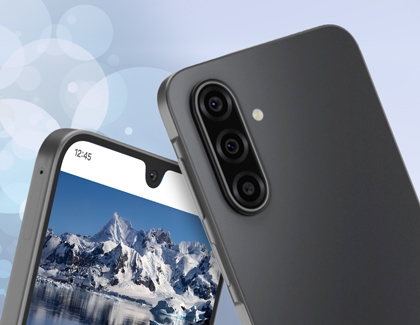 Rear of gray Galaxy A17 with triple cameras and a snowy mountain landscape on the screen.