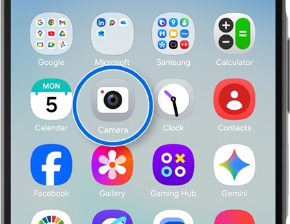 Apps screen showing various icons with a blue circle highlighting the Camera application icon.