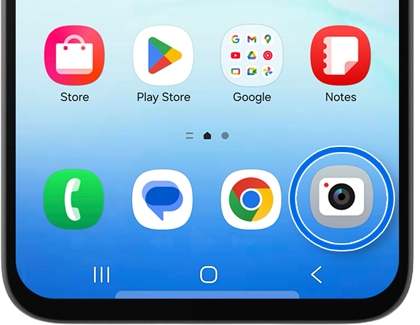 Phone home screen showing various app icons with a blue circle highlighting the Camera icon.