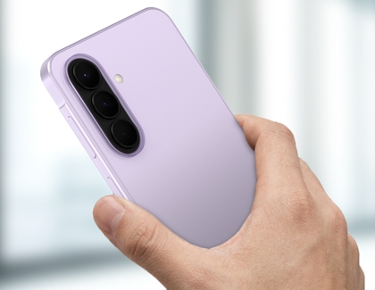 A hand holding a purple Galaxy A series phone from the back while pressing the side key.
