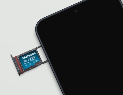 Samsung 512GB EVO microSD card partially inserted into the phone.