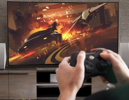 Person playing on a Samsung tv with a video game controller