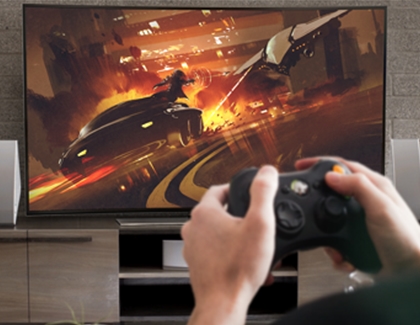person playing on his Samsung tv with a controller