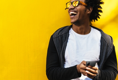 Man smiling with his Samsung Galaxy Note20