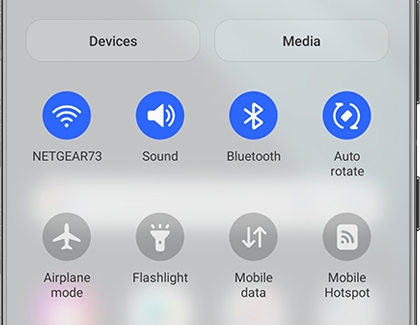 Quick Settings panel opened with some icons highlighted