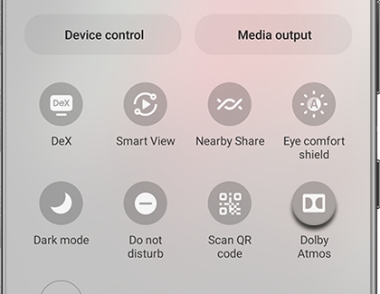 Dolby Atmos icon highlighted in the Quick Settings panel