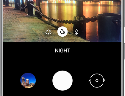 NIGHT selected in the Camera app with a nighttime scene in the background