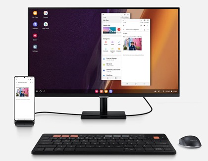 Samsung DeX pad with phone connected to monitor