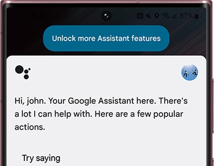 Google Assistant screen with "Unlock more Assistant features" displayed at the top
