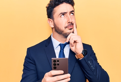 Puzzled guy holding a Galaxy phone