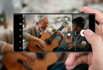 Person playing guitar in 8K Recording on a Galaxy S23 ultra