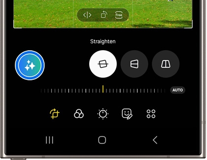 A smartphone screen showing photo editing tools, including a straighten feature and various adjustment icons.