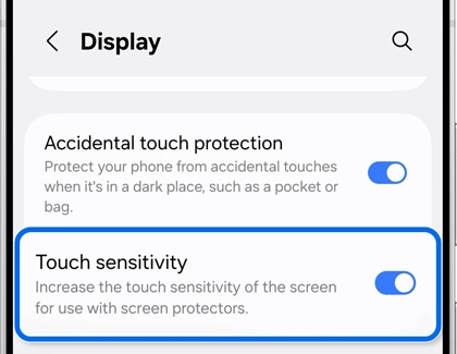 Display settings screen with Touch sensitivity highlighted and toggled on.