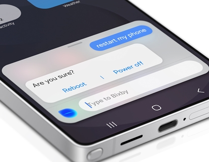 Galaxy S25 Ultra displaying a Bixby prompt with options to Reboot or Power off.