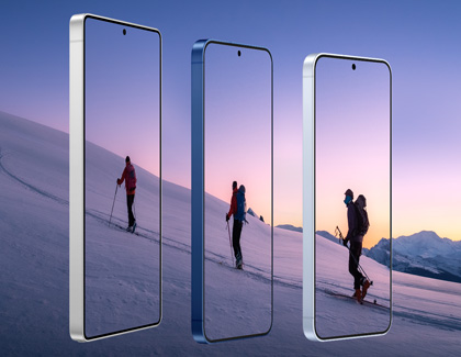 The three Galaxy S25 series devices showcasing images of a skier on a snowy slope.