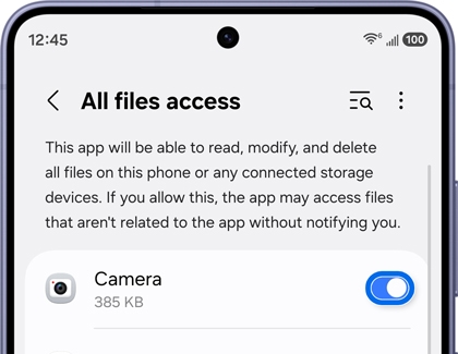 A Galaxy S26 screen showing the All files access settings with the Camera app toggle highlighted in a blue circle.