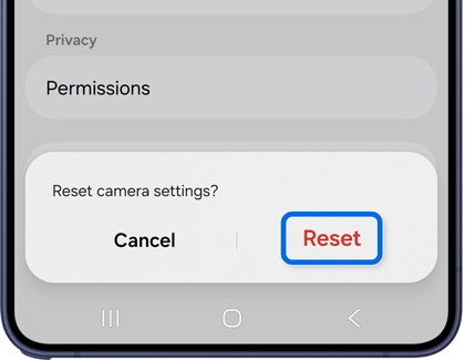 A Galaxy S26 screen showing a reset camera settings pop up with the Reset button highlighted in a blue box.