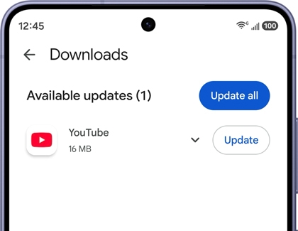 A Galaxy S26 screen showing the downloads page with a YouTube app update available and an Update all button highlighted in blue.