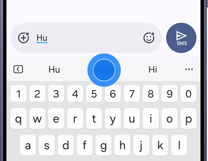 A text suggestion highlighted above the keyboard, indicating a tap and hold gesture.
