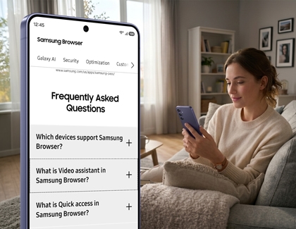 A purple Galaxy S26 phone showing a frequently asked questions webpage with a woman holding the phone on a couch in the background.