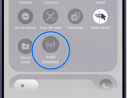 A Galaxy S26 quick settings panel with the Audio broadcast icon highlighted in a blue circle.