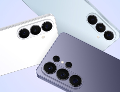 Close up of three Galaxy S26 Ultra phones in white, light blue, and purple, highlighting their rear cameras.
