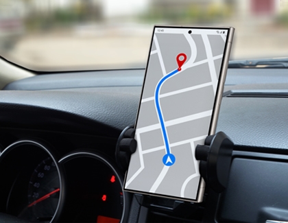 A Galaxy device mounted on a car dash and showing a navigational map.