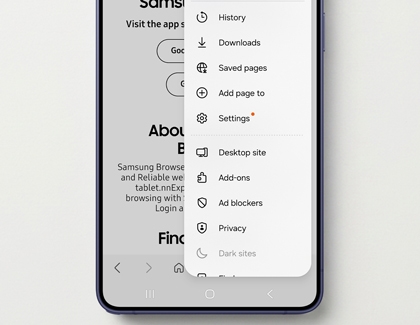 A purple Galaxy S26 phone showing the Samsung Browser menu with options like History Downloads and Settings.