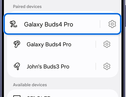 The settings icon highlighted next to a paired Bluetooth device name.