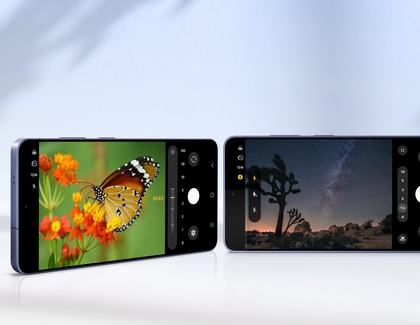 Two Galaxy S26 Ultra showing the camera app capturing a macro shot of a butterfly and a night sky landscape at 12MP resolution.