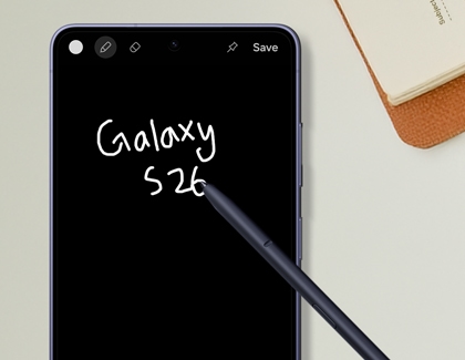 A purple Galaxy S26 Ultra with a black screen, showing the words Galaxy S26 written in white using a stylus.
