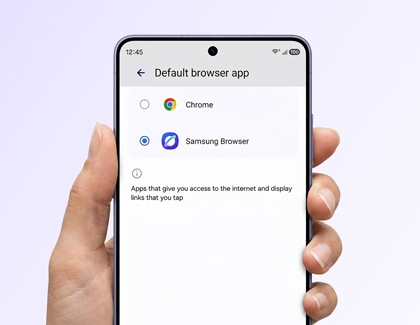 A person holding a purple Galaxy S26 phone showing the Default browser app menu with Samsung Browser selected.