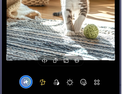 A Galaxy S26 phone screen showing an image of a cat being edited with the photo assist icon highlighted in blue at the bottom.