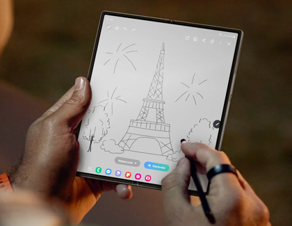 Person sketching the eiffel tower on the Galaxy Z Fold6 while using the S Pen Fold Edition