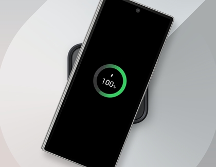 Galaxy Z Fold6 charging on a wireless charging pad