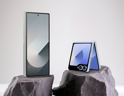 Galaxy Z Fold6 and Z Flip6 placed on top of a rock