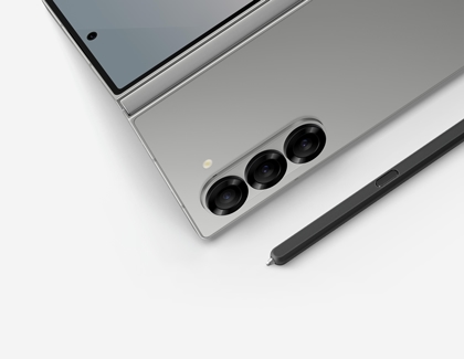 Galaxy Z Fold6 partially opened alongside the S Pen Fold Edition