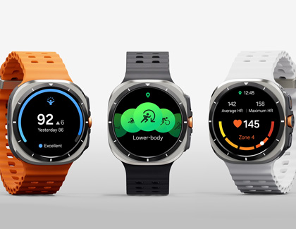 Three Galaxy Watch Ultra's side by side with different colored watch bands, orange, black, and white